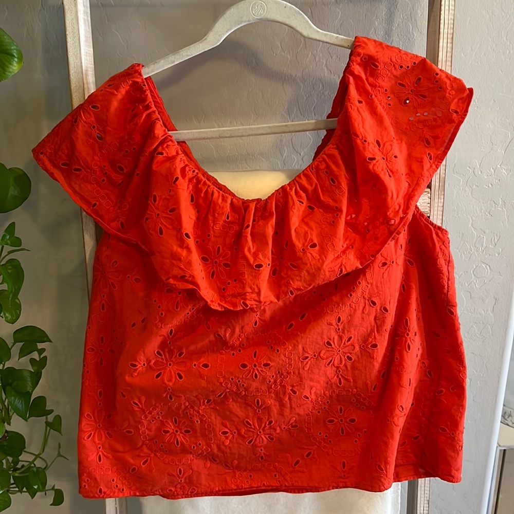 Red Ann Taylor cutout patterned blouse with ruffle neckline detail